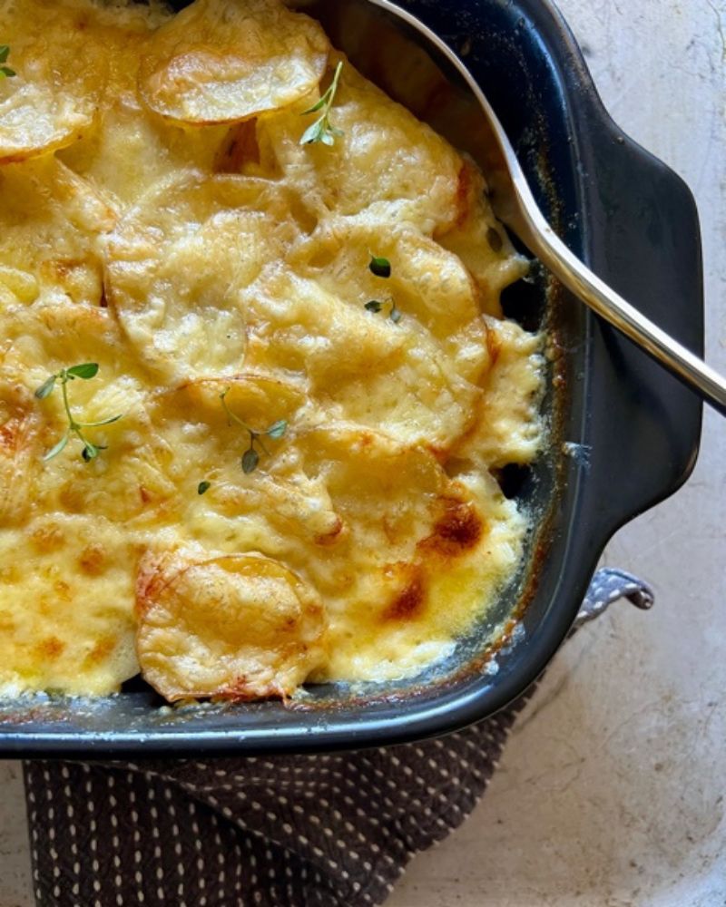 Creamy Potato & Pumpkin Bake a dish with spoon