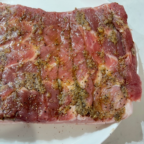 underside of pork belly with marinade