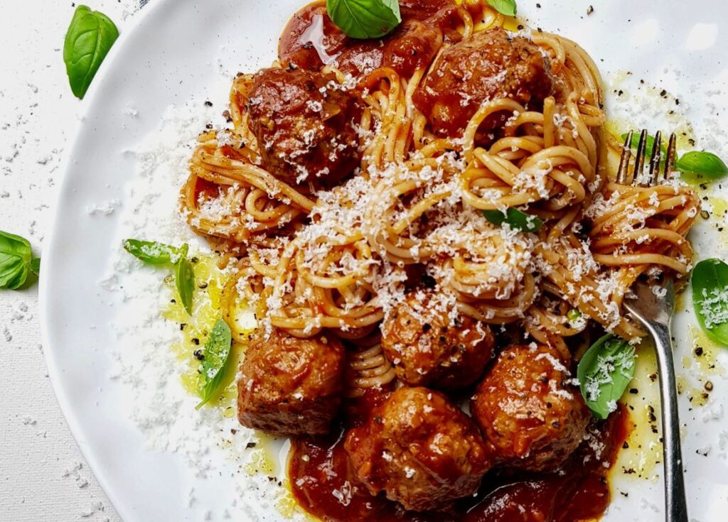 spaghetti & meatballs on white plate