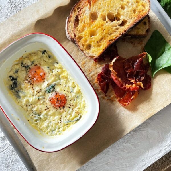 baked eggs with toast and proscuitto