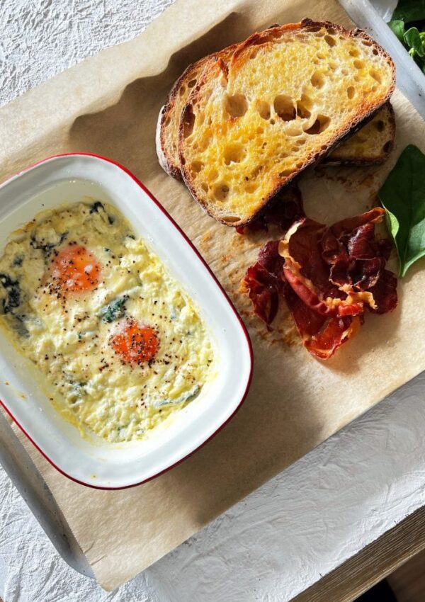 baked eggs with toast and proscuitto