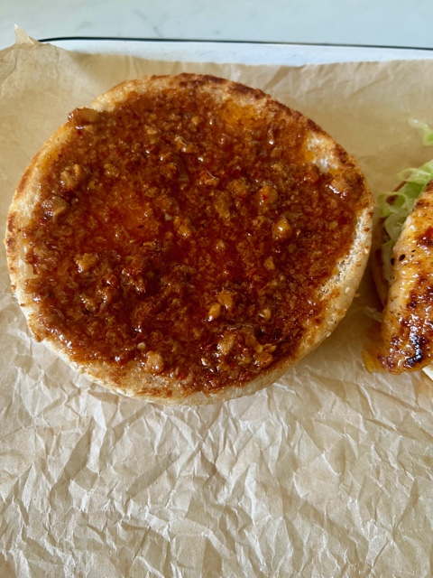 Burger bun spread with loads of Peri Peri Sauce