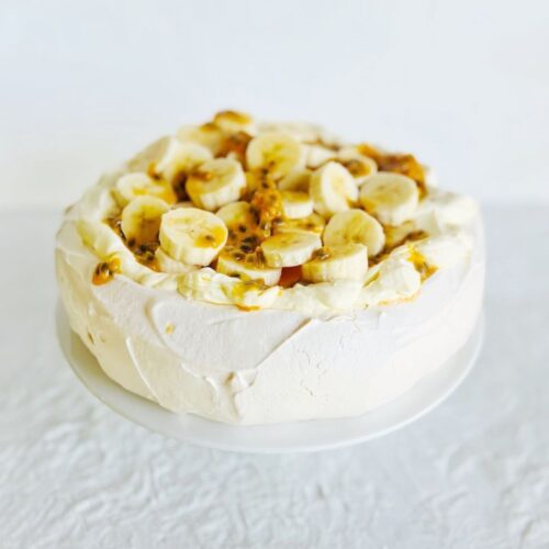 PAVLOVA TOPPED WITH BANANA AND PASSIONFRUIT