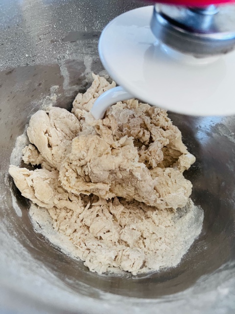 pita bread dough in kitchen aid mix master being kneaded