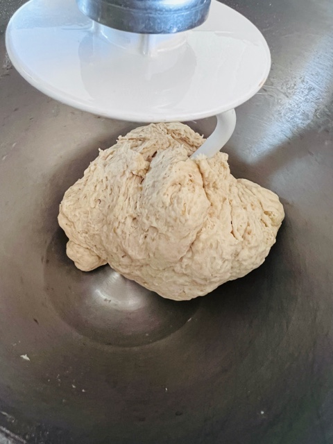 Pita bread in mix master being kneaded