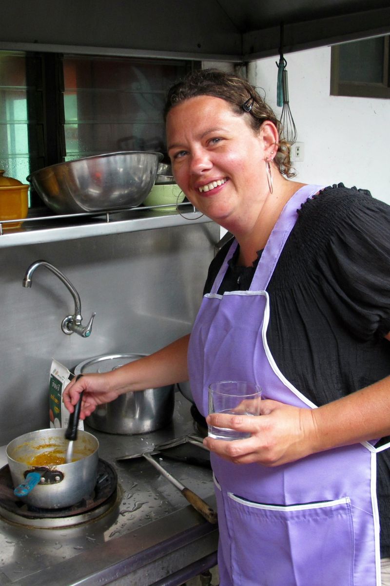 person cooking at a stove