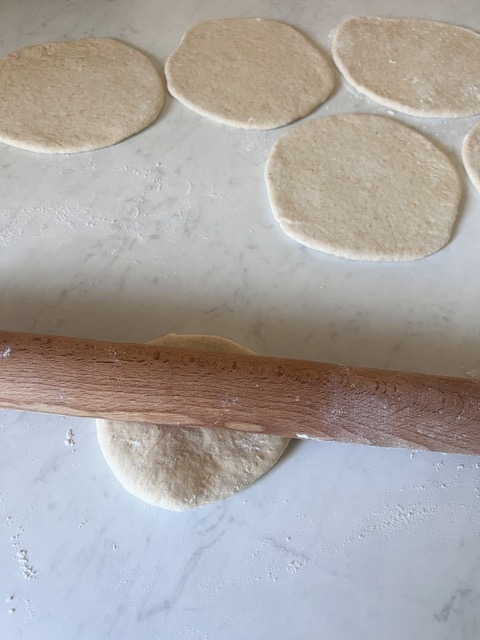 Pita bread being rolled