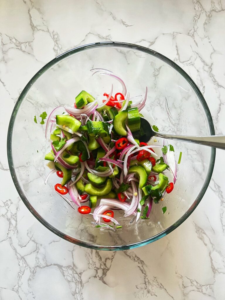 pickled cucumber salad in glass bowl