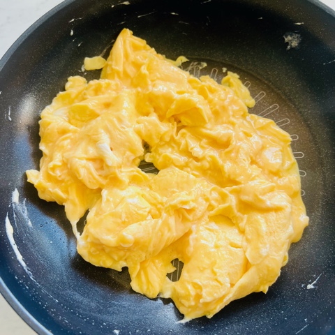 scrambled eggs finished cooking in a pan