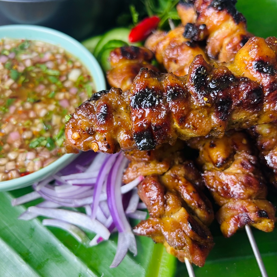 Thai Grilled chicken skewers close up of them