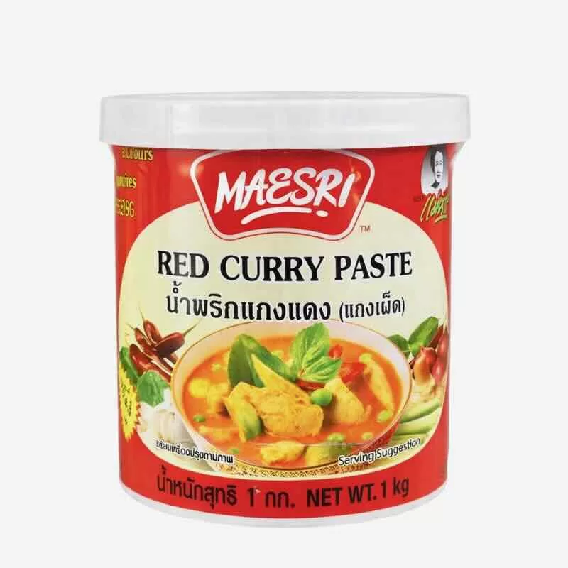 Tub of Maeri curry paste with a white background