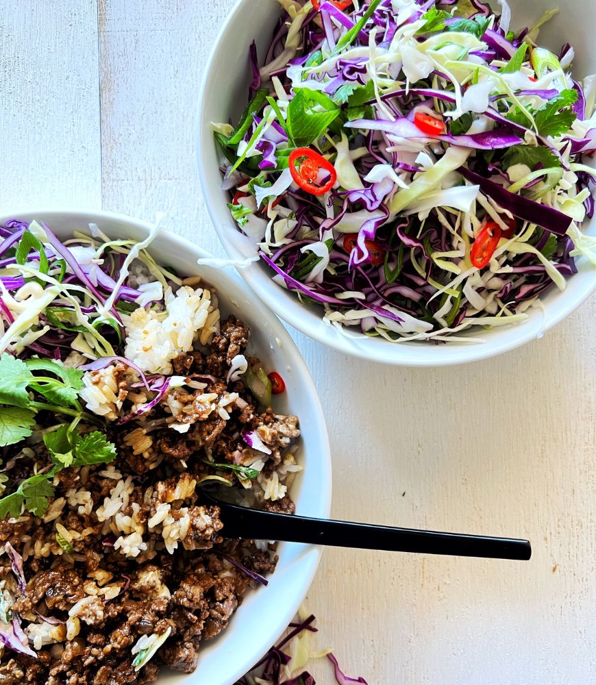 20 minute asian beef bowls and a bowl of slaw