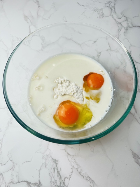 eggs, flour and milk in a bowl