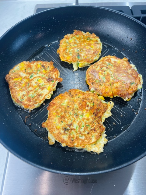 fritters cooking in a apn