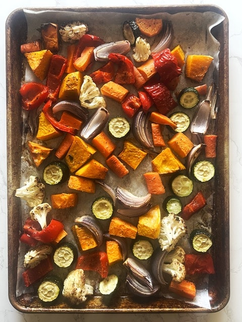 roasted mixed vegetables on a baking tray