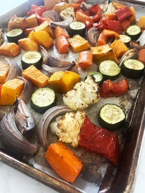 Roasted mixed vegetables on a baking tray