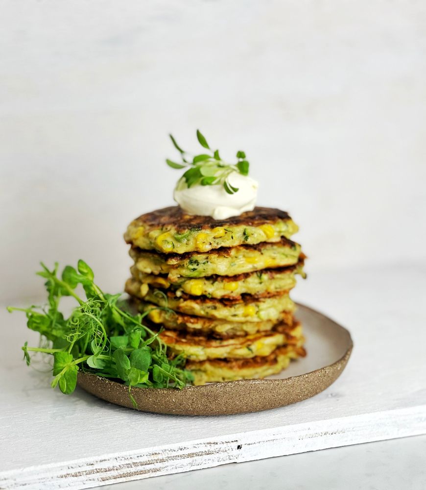 zucchini fritters with sour cream on top