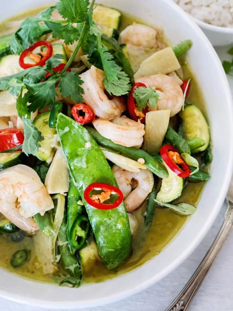 close up of Thai Green prawn curry in a white bowl