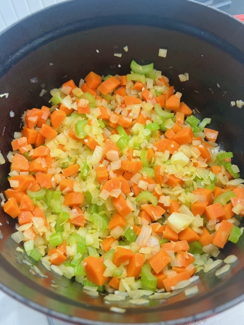 carrot, onion and celery cooking in pot