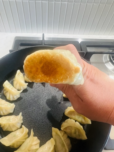 dumpling after steam cooking with golden base on it
