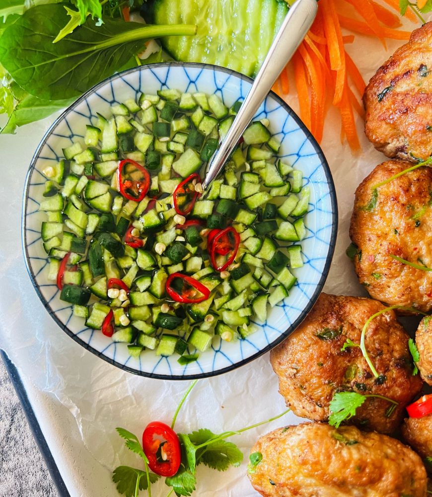 Sweet and Sour Thai Cucumber Dipping Sauce in a bowl with silver spoon