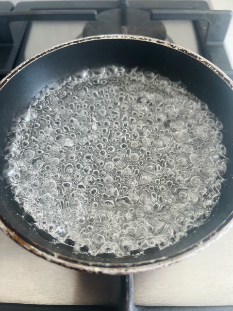 liquid boiling in a pan