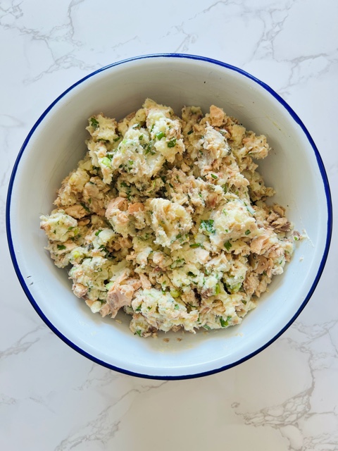 salmon & potato cake mixture in white bowl