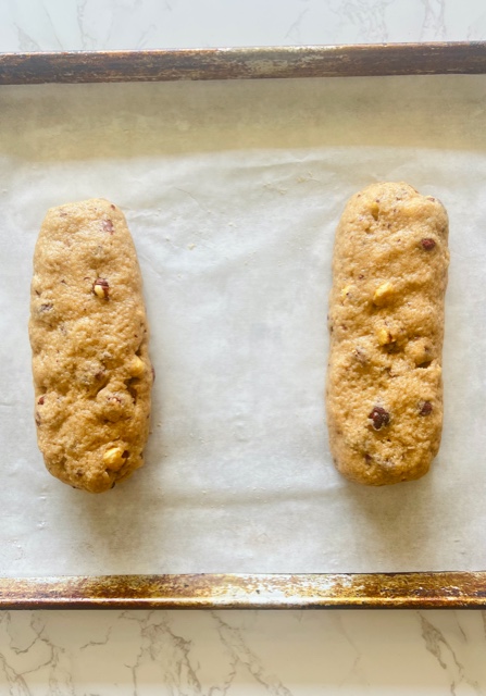 biscotti logs on tray before baking