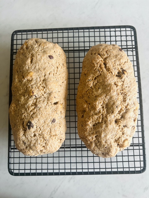 two biscotti logs on a wire rack