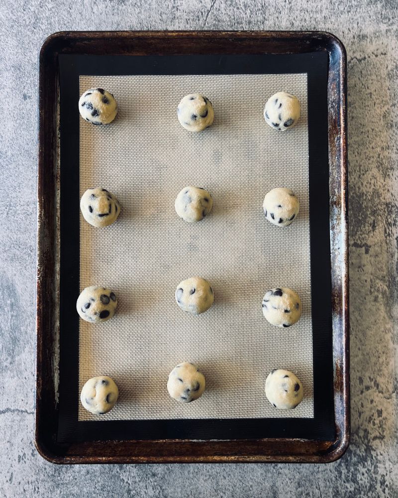 cookie dough balls on baking tray