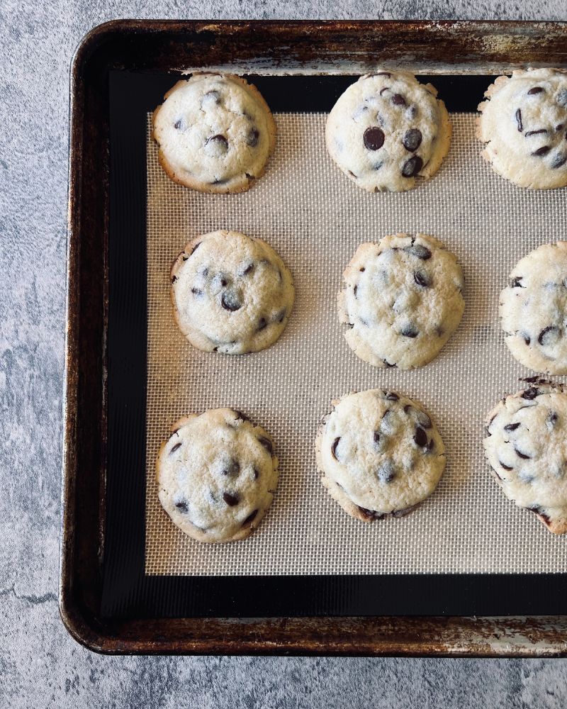 choc chip cookies on a baking tray baked