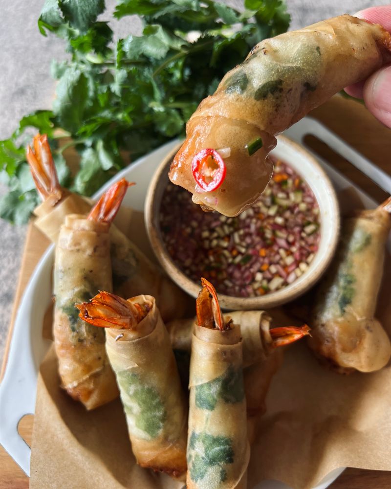 dipping spring roll in sauce