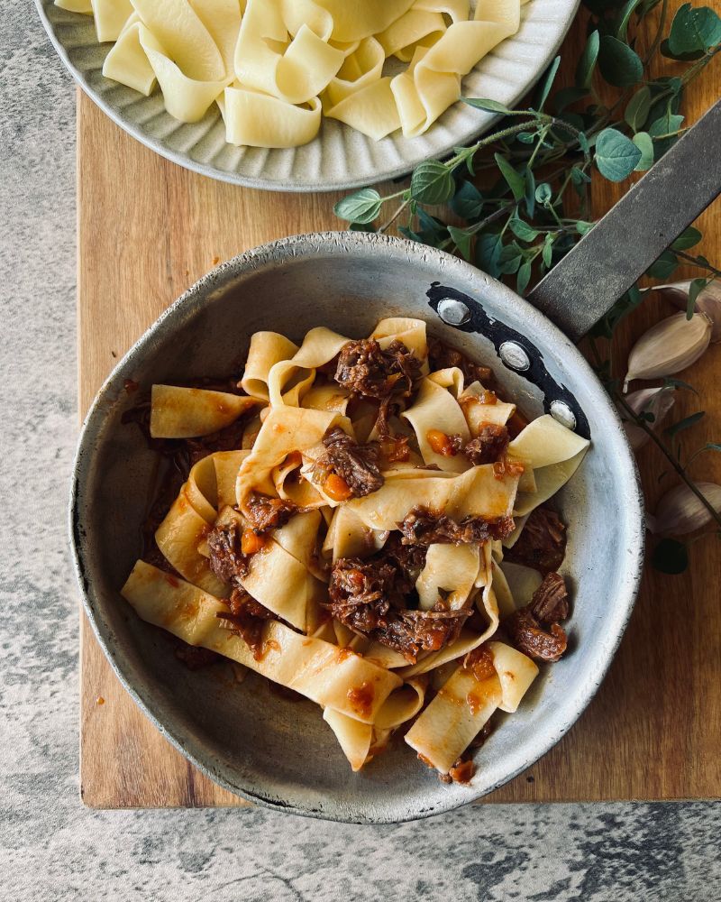 beef sauce with pasta in frying pan