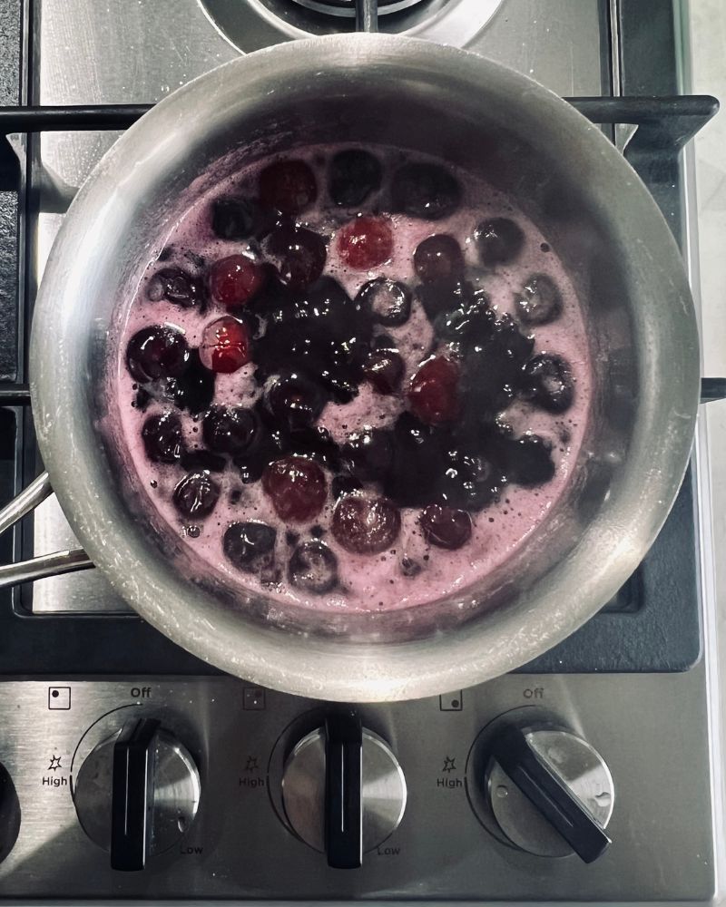 boiling cherries, sugar and water in a saucepan