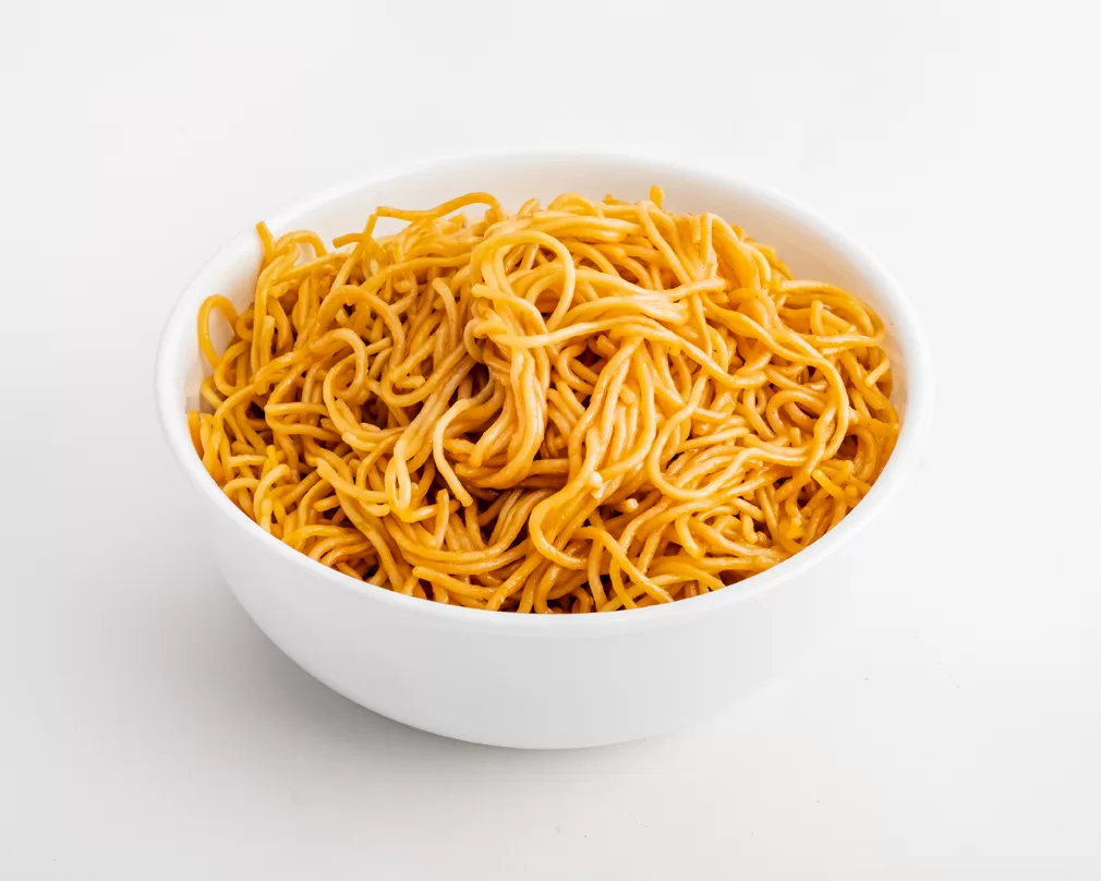 noodles in a white bowl, white background