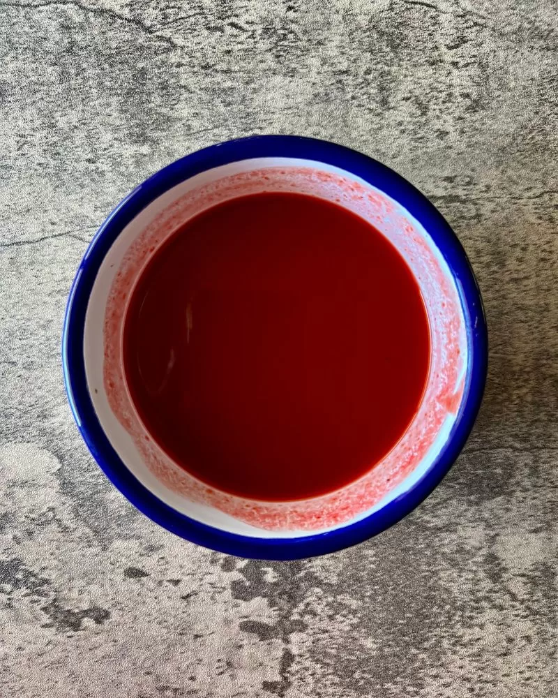 sweet and sour sauce in bowl bowl, marble background