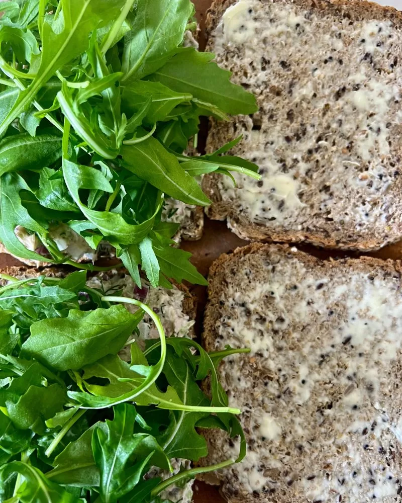 bread topped  with rocket leaves