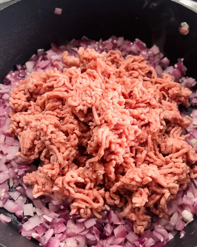 onions and mince cooking in a pan