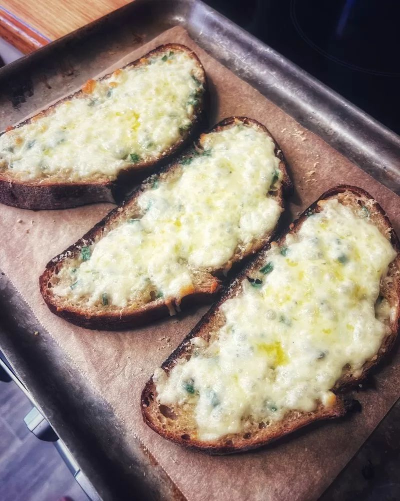 Cheesy Sourdough Bread Slices on a baking tray