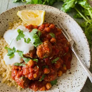 Lamb meatball tagine in a bowl with yoghurt