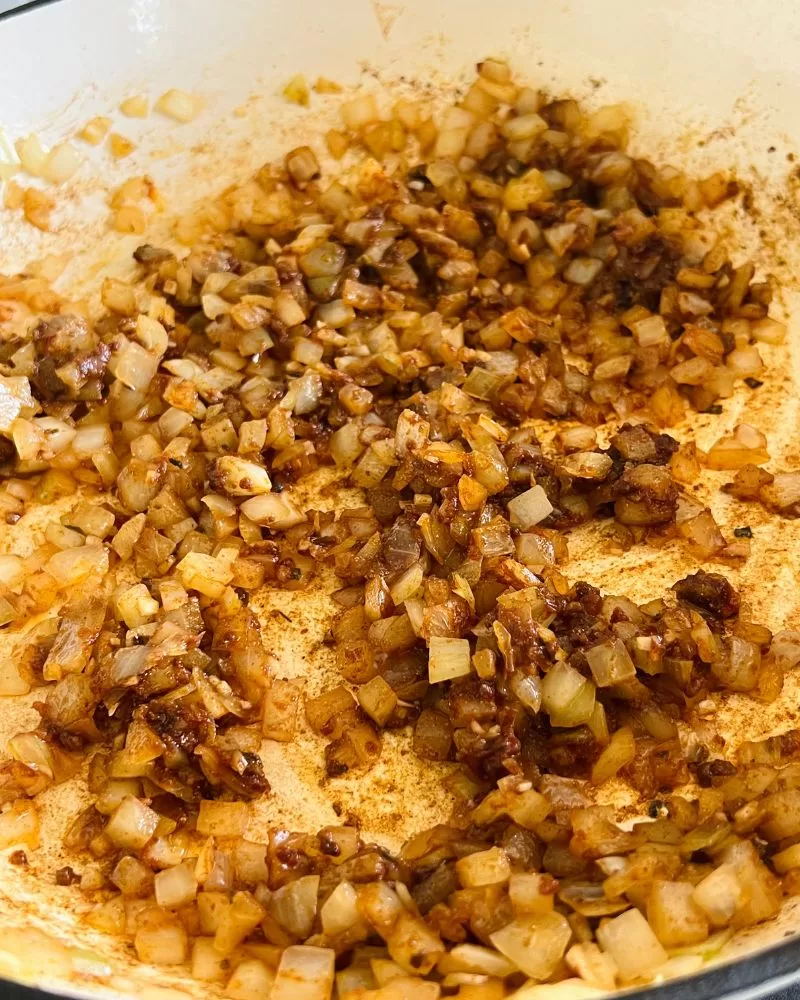 onion and spices cooking in a pan