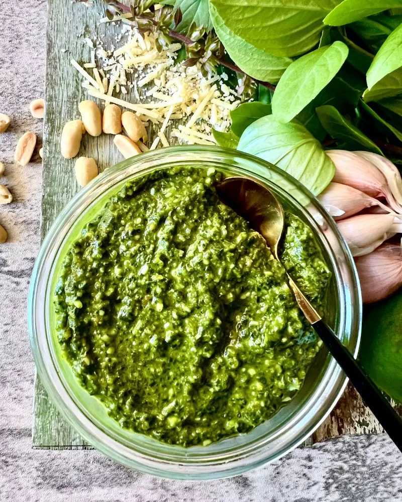 basil pesto in dish with ingredients 