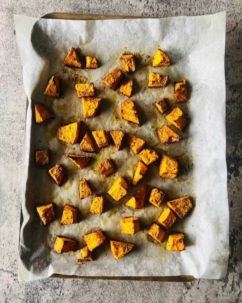 diced cooked pumpkin on a tray