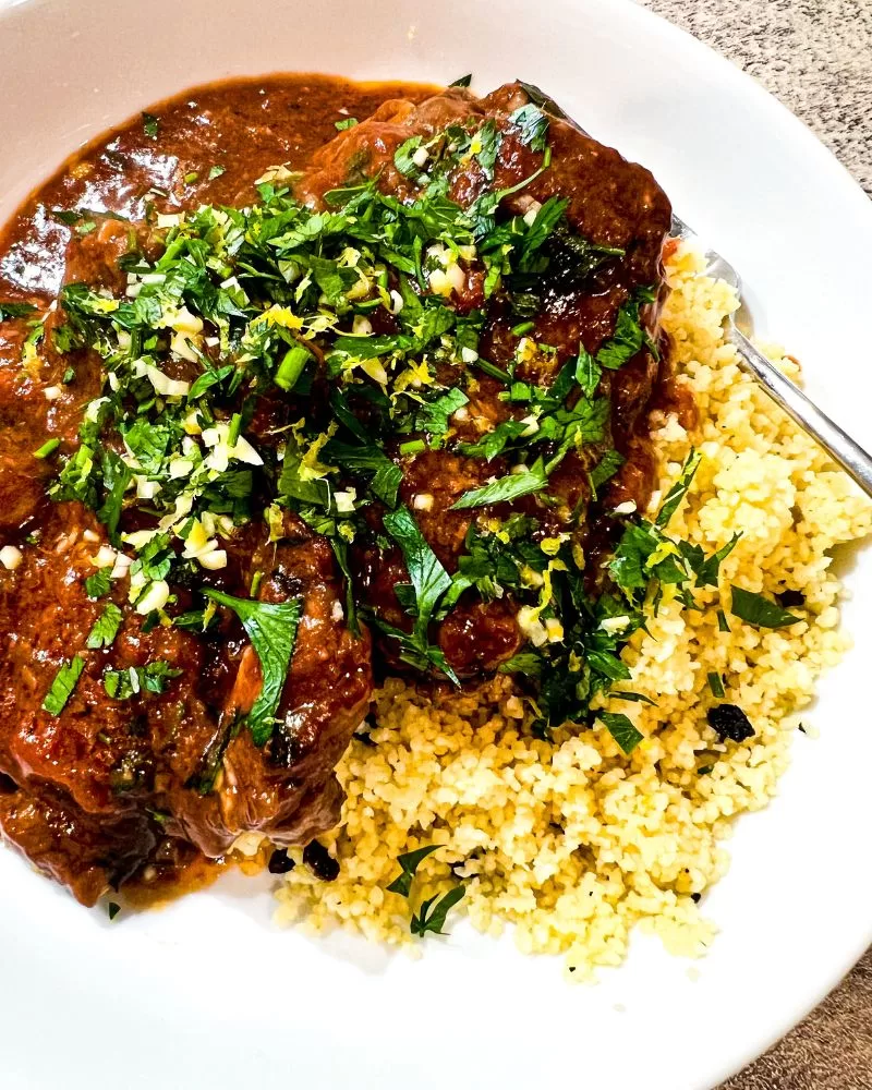 slow simmered lamb in tomatoes, garlic and red wine
