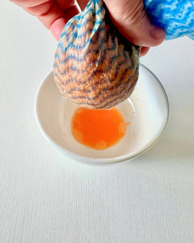 squeezing carrot juice out