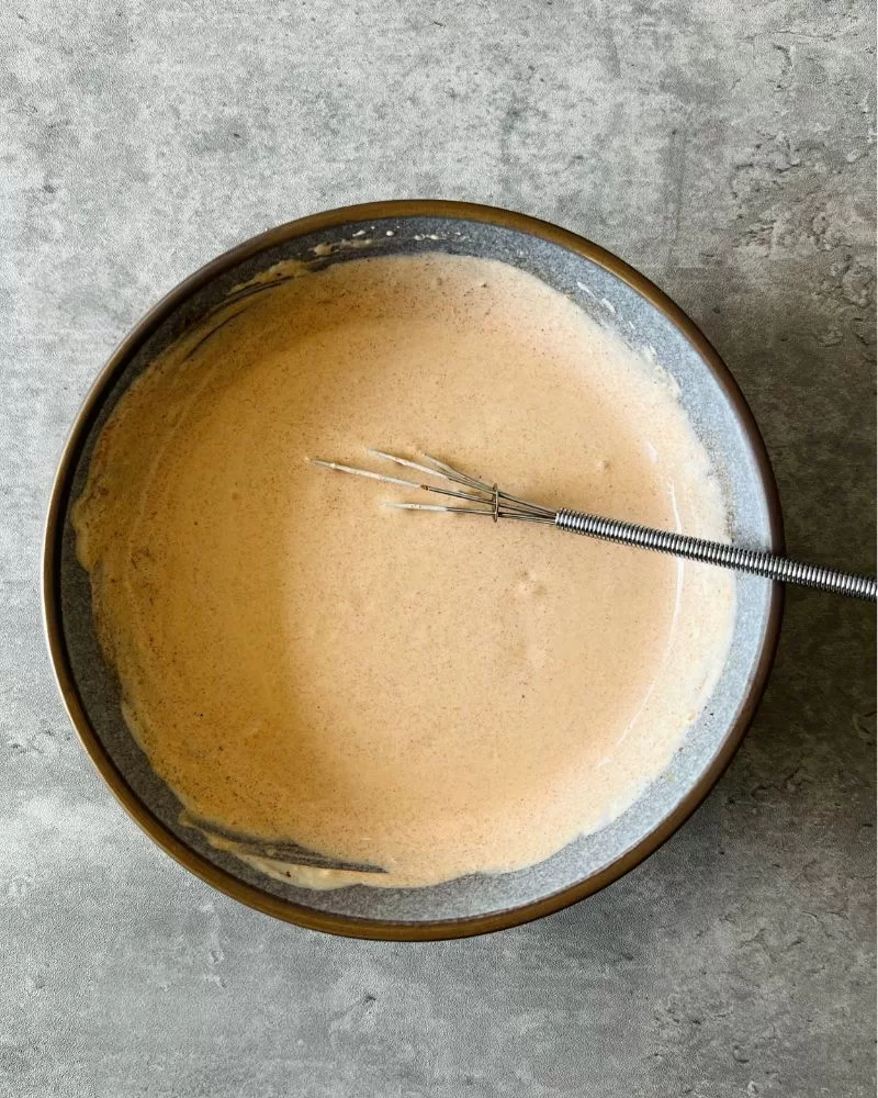 whisked chipotle dressing in grey bowl