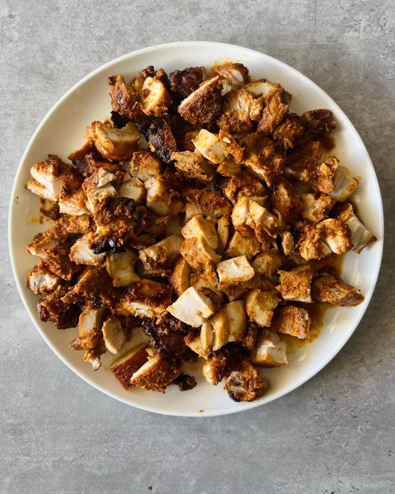 diced cooked chicken on white plate