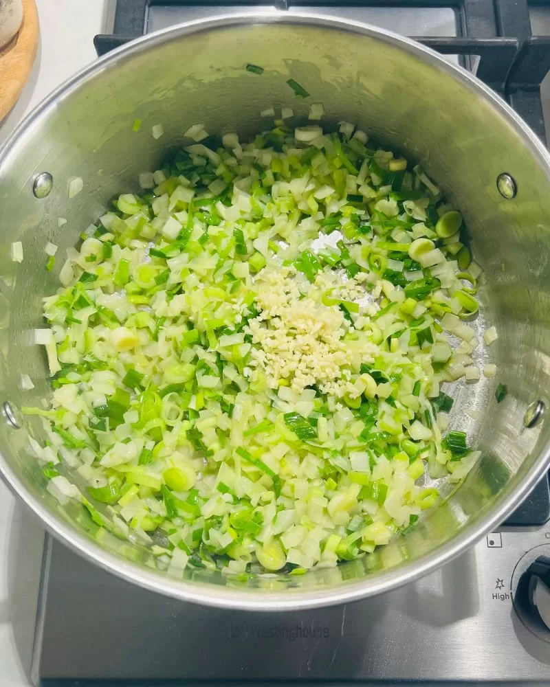 cooking onion, leeks and garlic in saucepan
