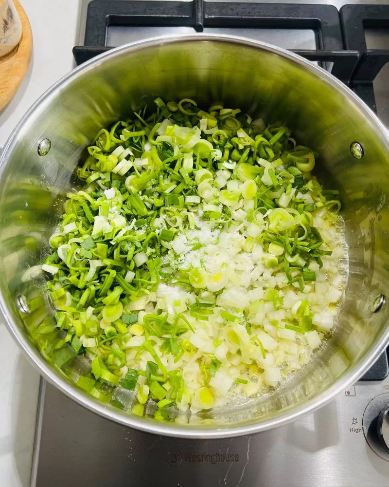 cooking onions and leek in saucepan
