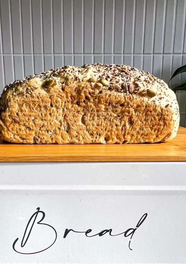 five grain bread loaf on a bread tin unsliced
